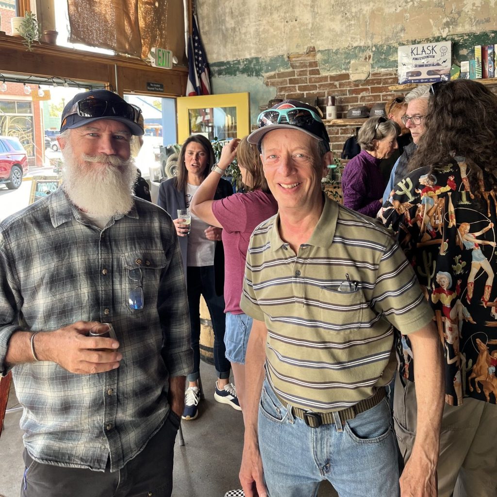 P.T. Wood standing with resident at an event